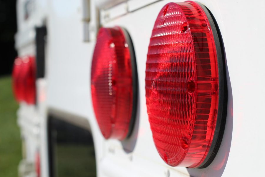 Close up of the bright red bus lights.